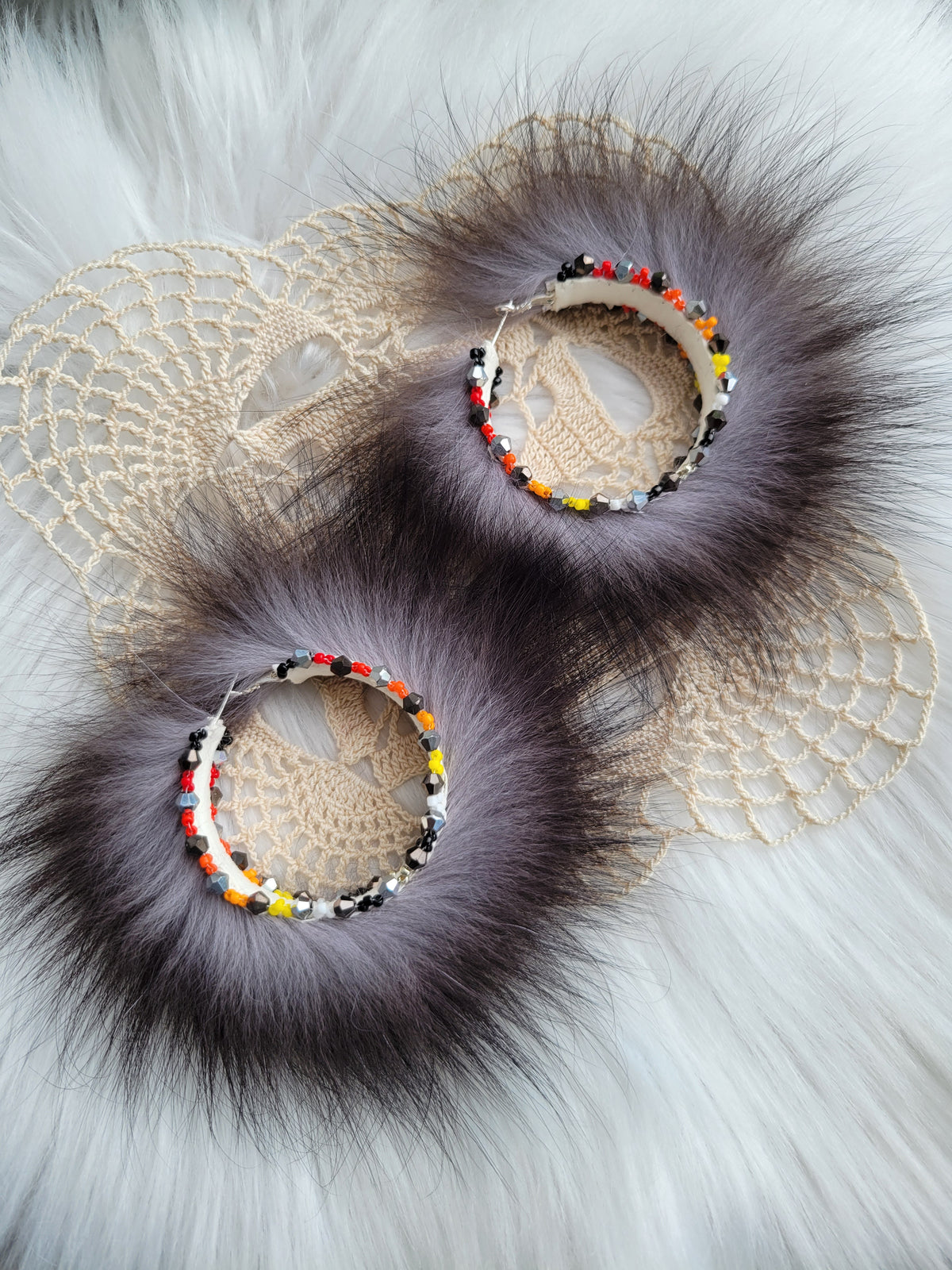 50mm Silver Fox hoop earrings with fire colors beaded edges.