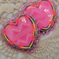 Stacked neon glow hearts
