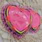 Stacked neon glow hearts