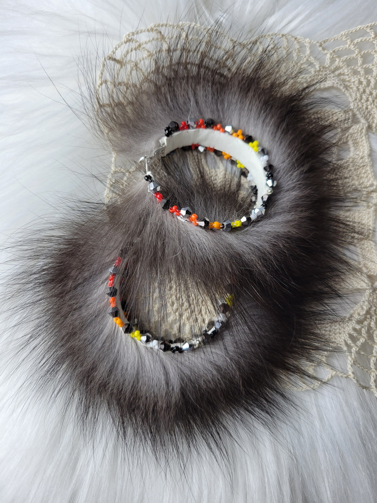 50mm Silver Fox hoop earrings with fire colors beaded edges.