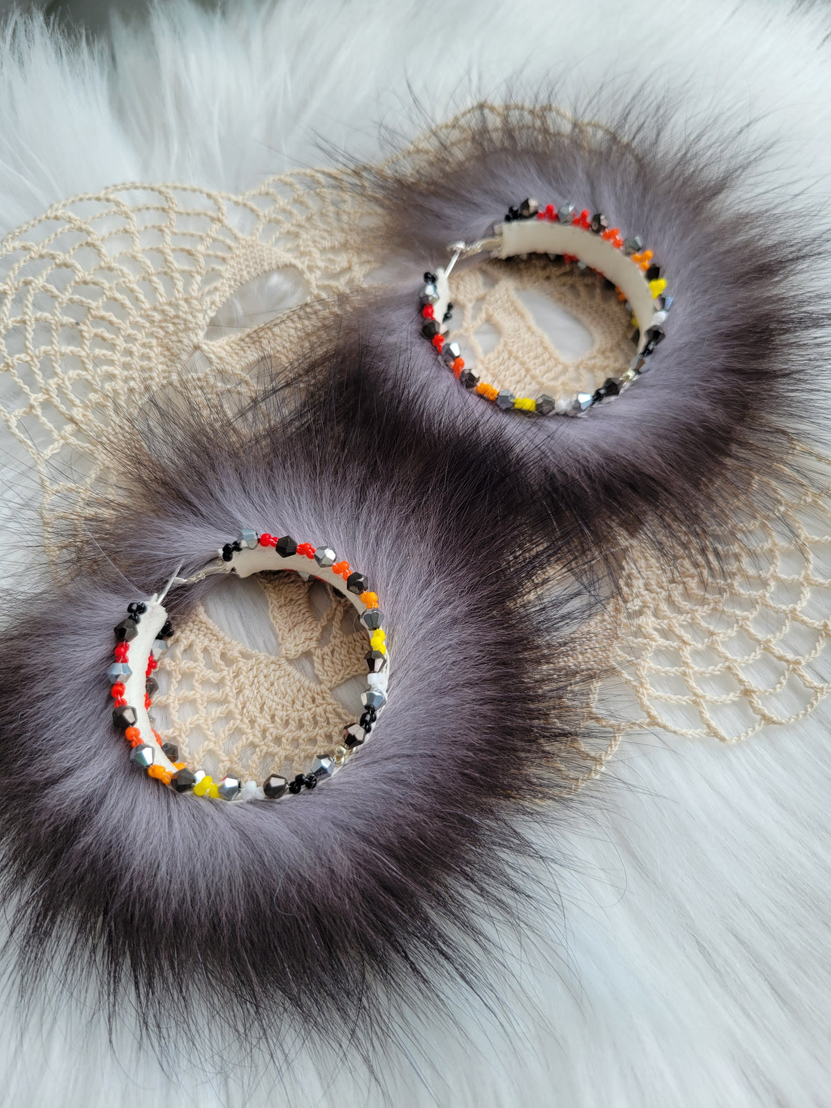 50mm Silver Fox hoop earrings with fire colors beaded edges.